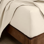 Flannel fitted sheet on a wooden bed frame