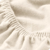 Close up of the elastic portion of a flannel fitted sheet