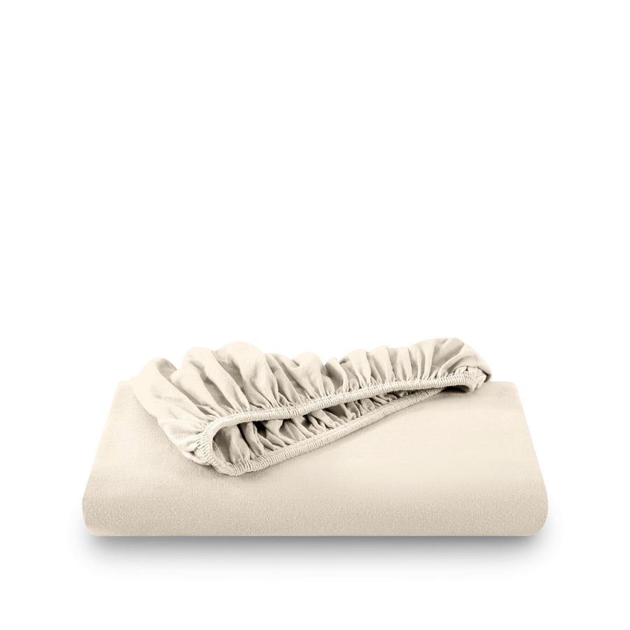 Sand fitted sheet on white background