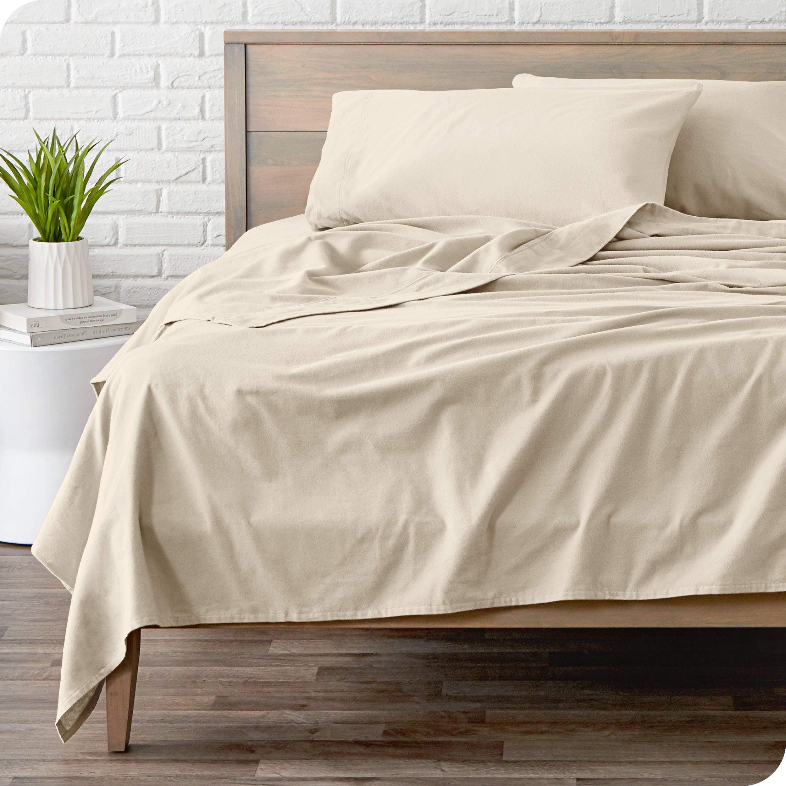 A modern bed with a flannel sheet set on