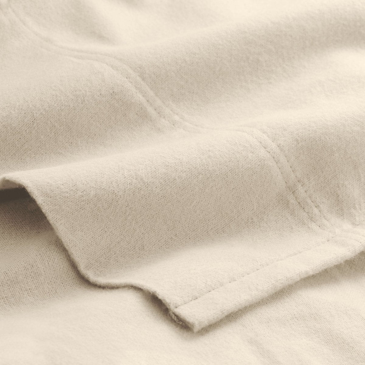 Close-up of flannel fabric with a focus on texture and color.
