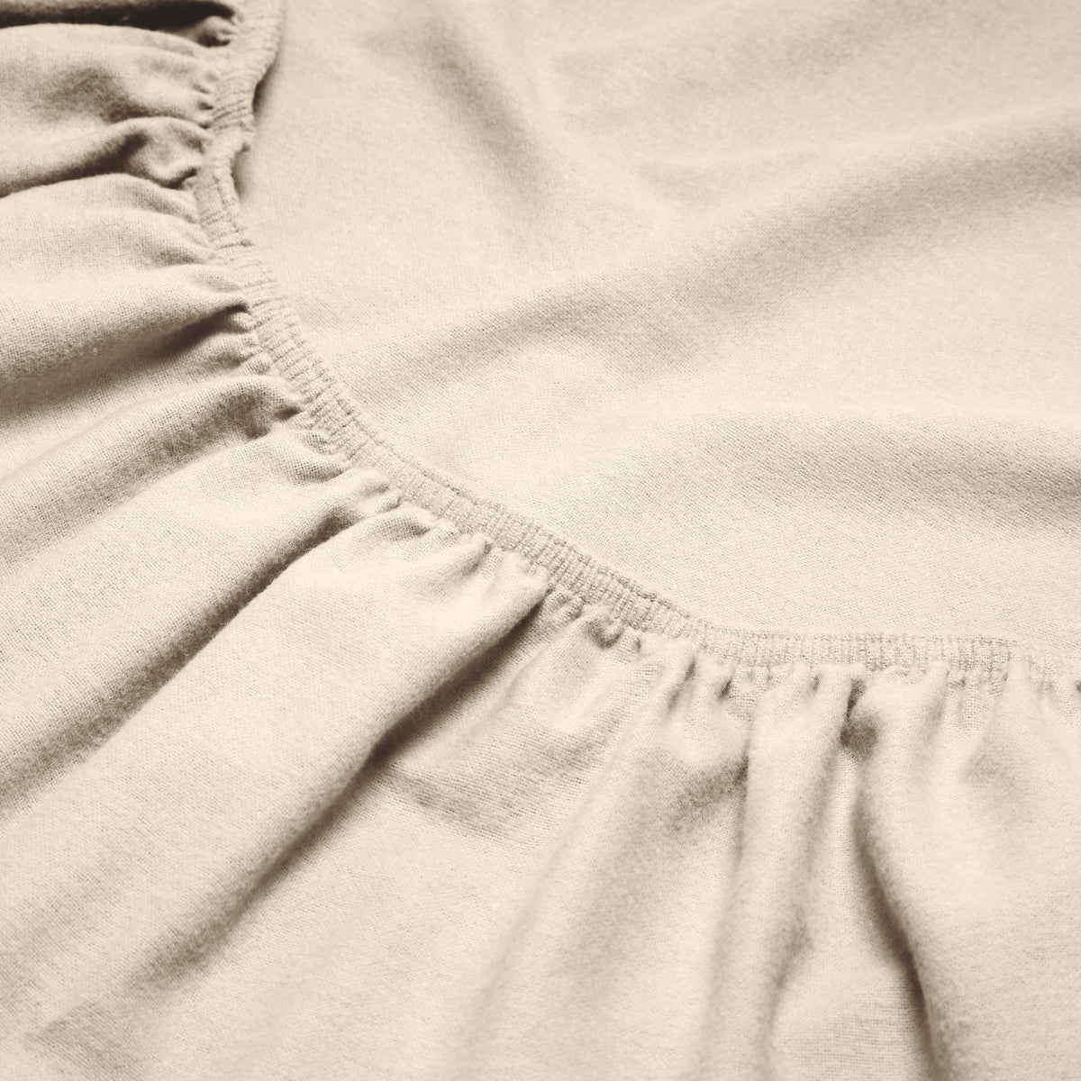 Close-up of a flannel fitted sheet with gathered elastic