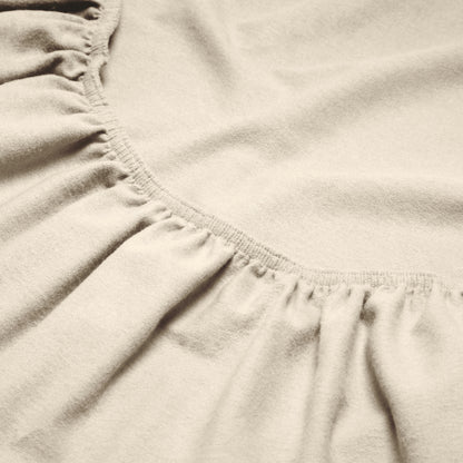 Close-up of a flannel fitted sheet with gathered elastic