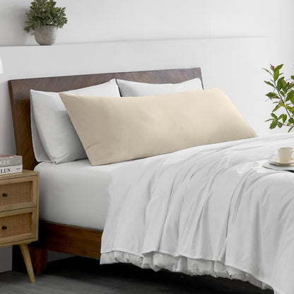 Bed with microfiber bedding and wooden headboard in a bedroom setting