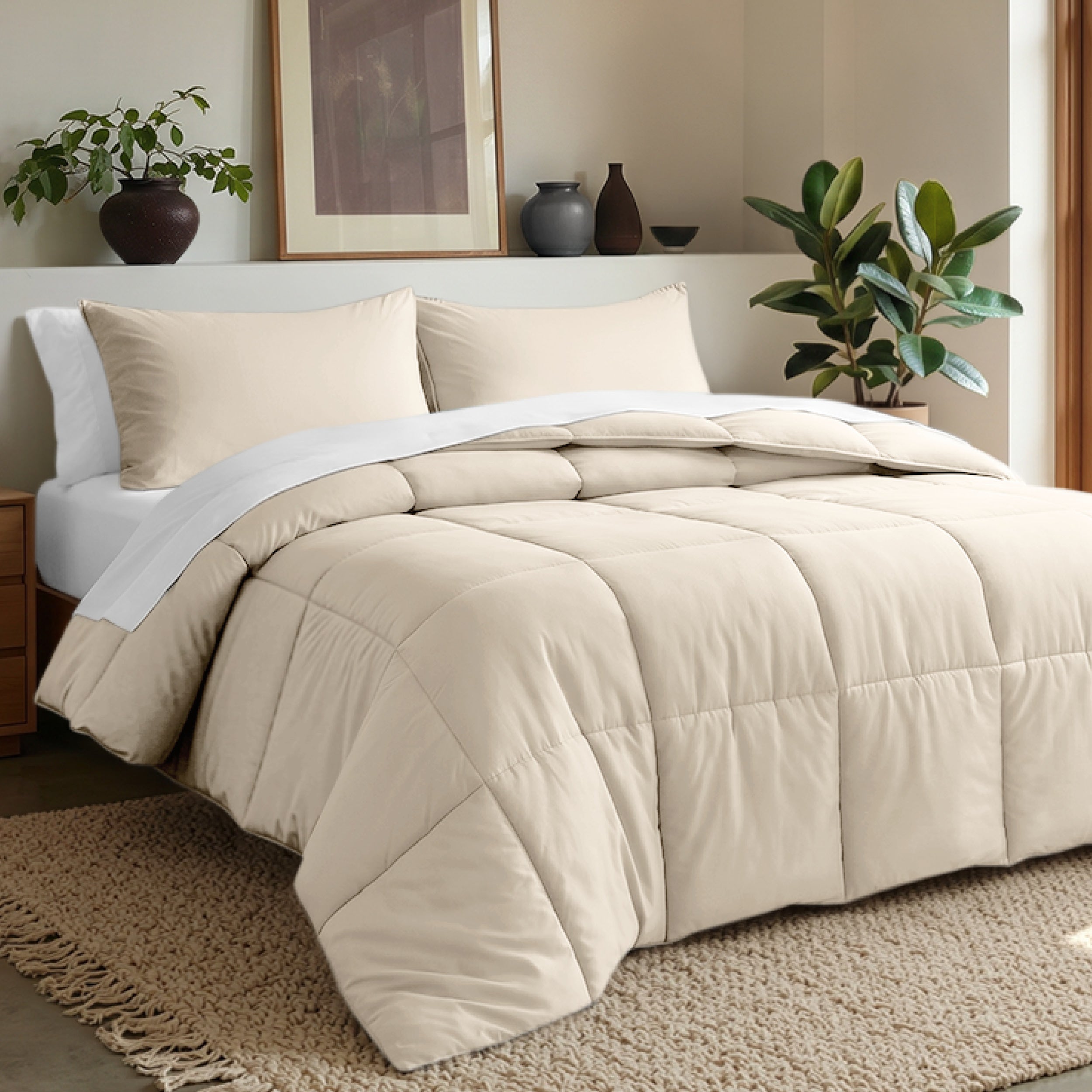 Comforter set on a bed in a bedroom with plants and decor.
