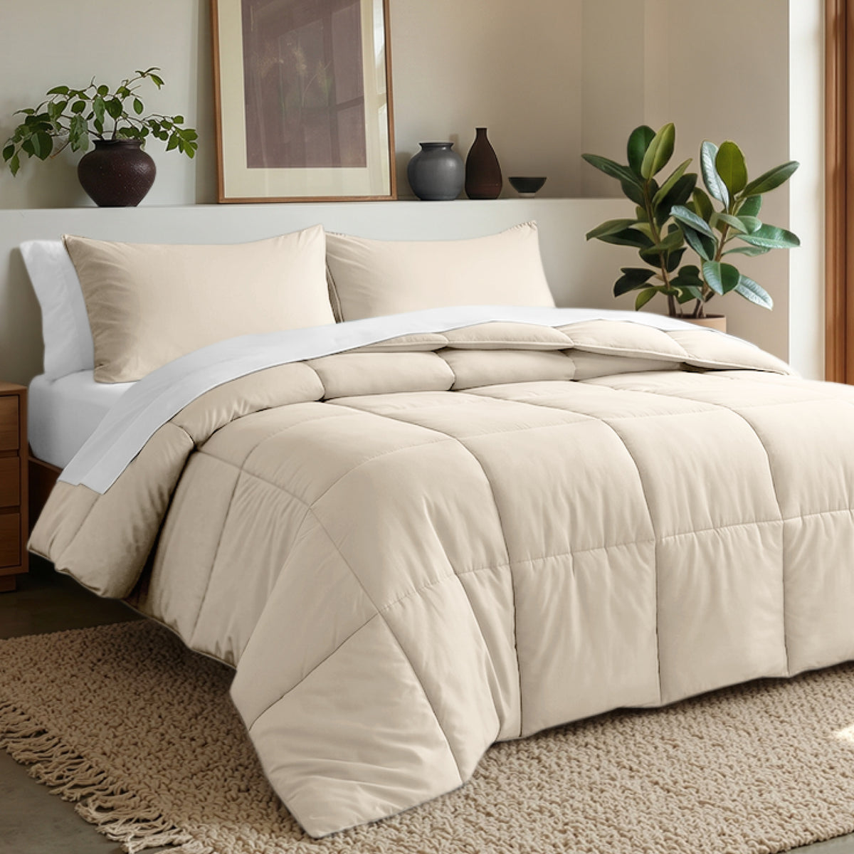 Comforter set on a bed in a bedroom with plants and decor.