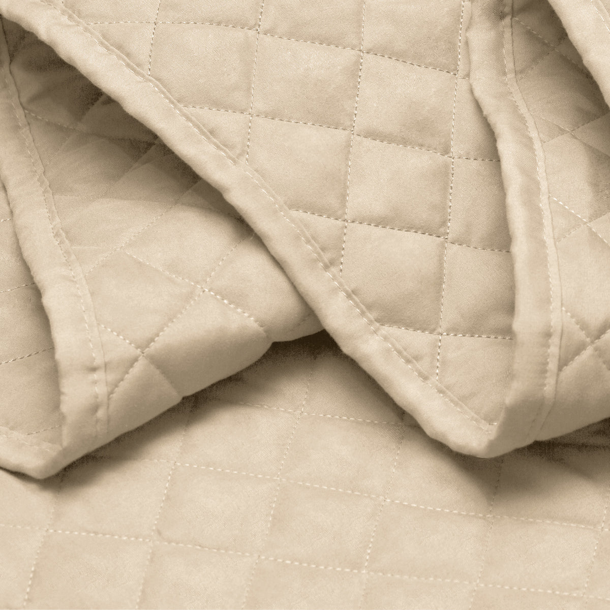 Close in view showing texture of coverlet set fabric