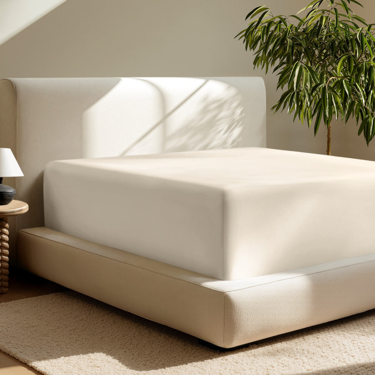 A deep pocket fitted sheet on a mattress