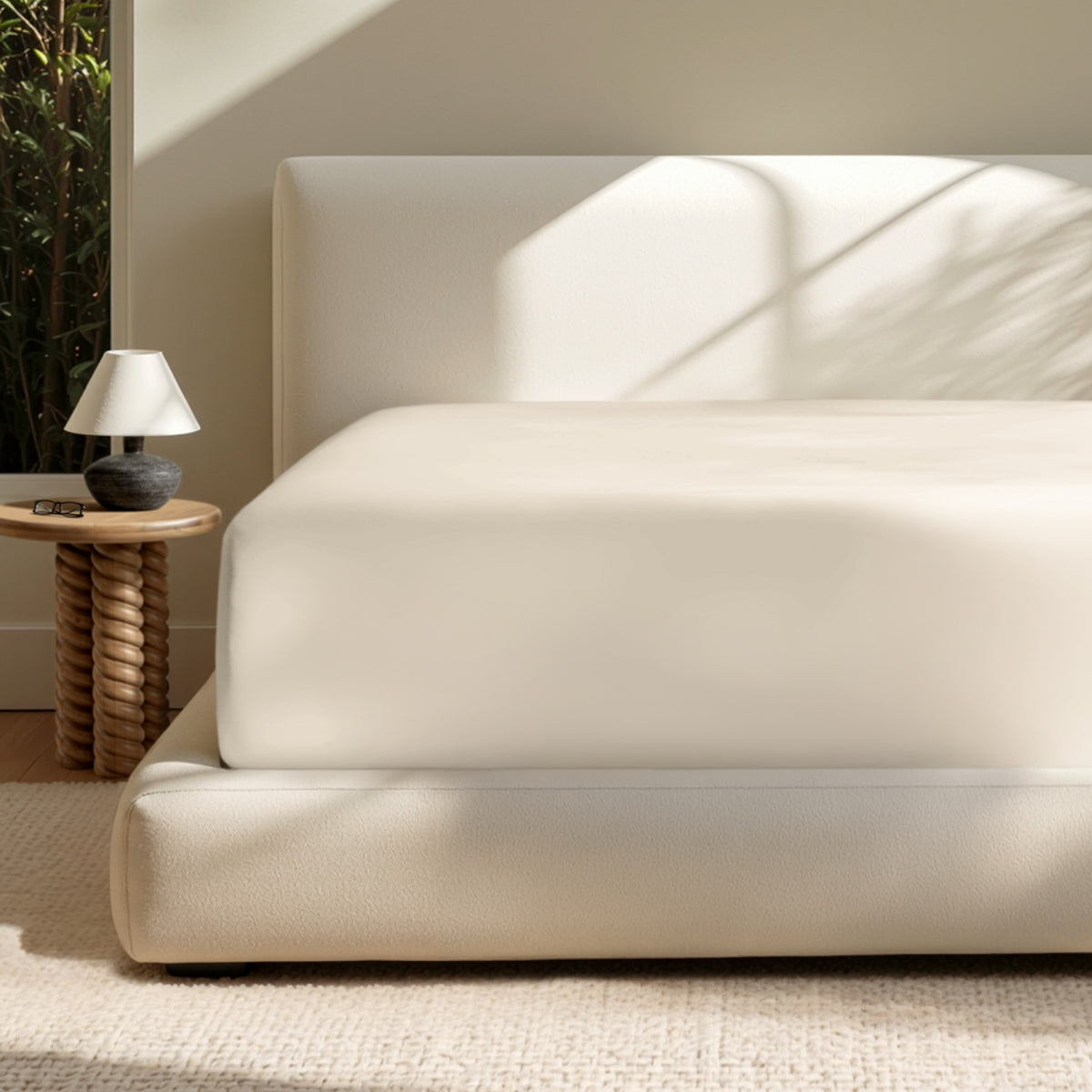 A deep pocket mattress with a fitted sheet on it