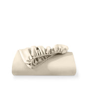 A fitted sheet folded neatly with the all around elastic showing