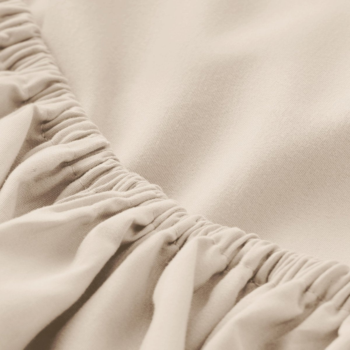 Close-up of elastic on a fitted sheet.