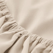 Close-up of elastic on a fitted sheet.