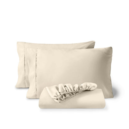 Pillowcases and a matching fitted sheet folded in front, shown on a plain white background.