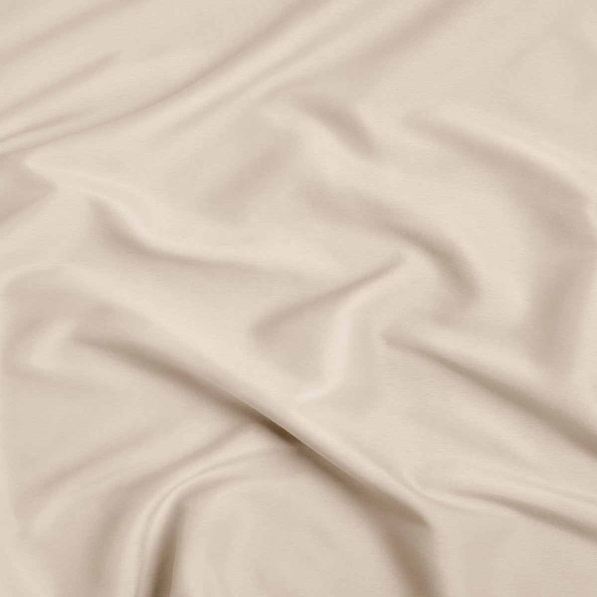 A close-up of ultra soft sheet fabric with soft folds and a smooth texture