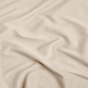 A close-up of ultra soft sheet fabric with soft folds and a smooth texture