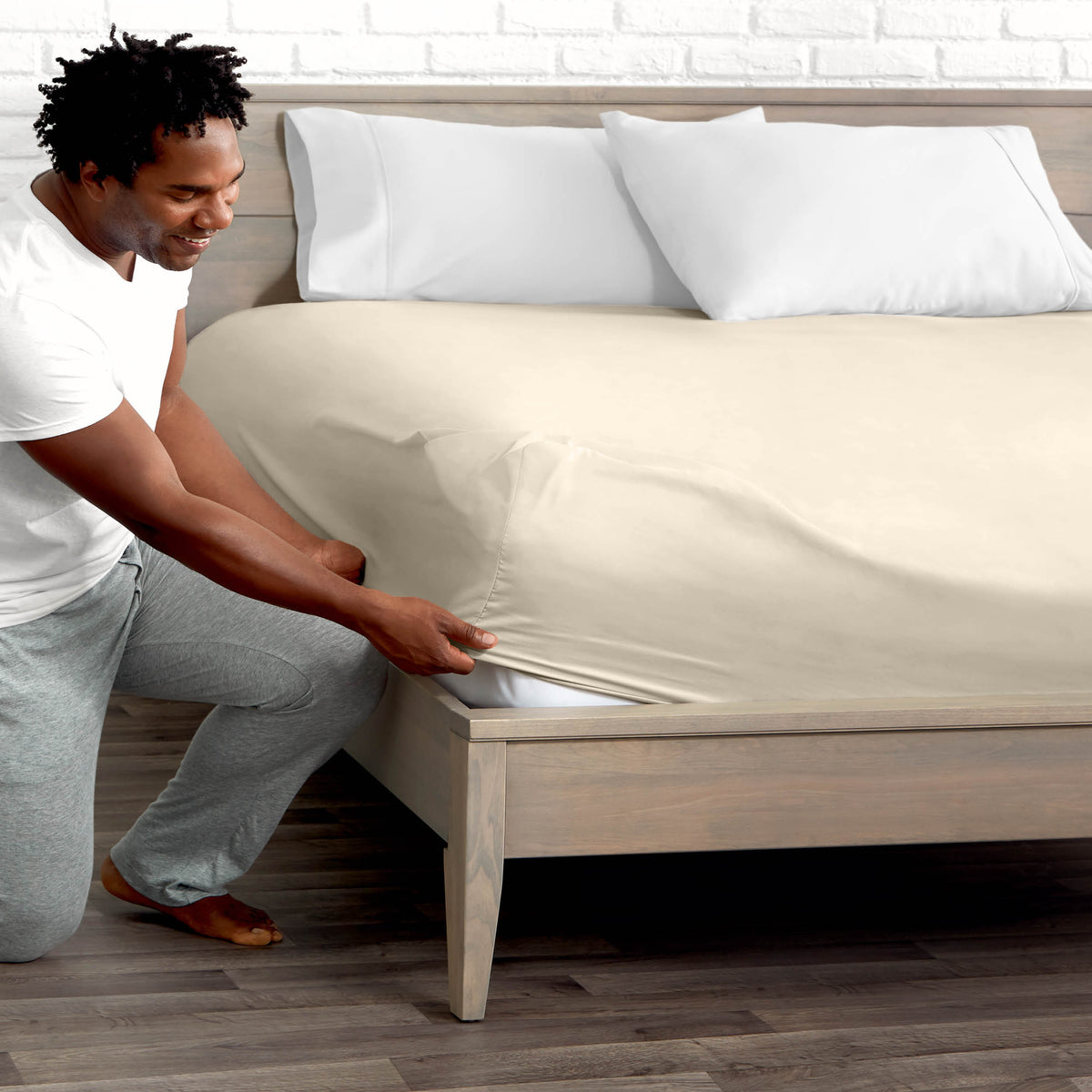 Ultra soft fitted sheet on a mattress with the sun shining into the bedroom