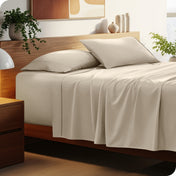Bed with microfiber bedding and wooden headboard in a bedroom setting