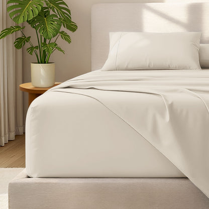 Bed with microfiber bedding and wooden headboard in a bedroom setting