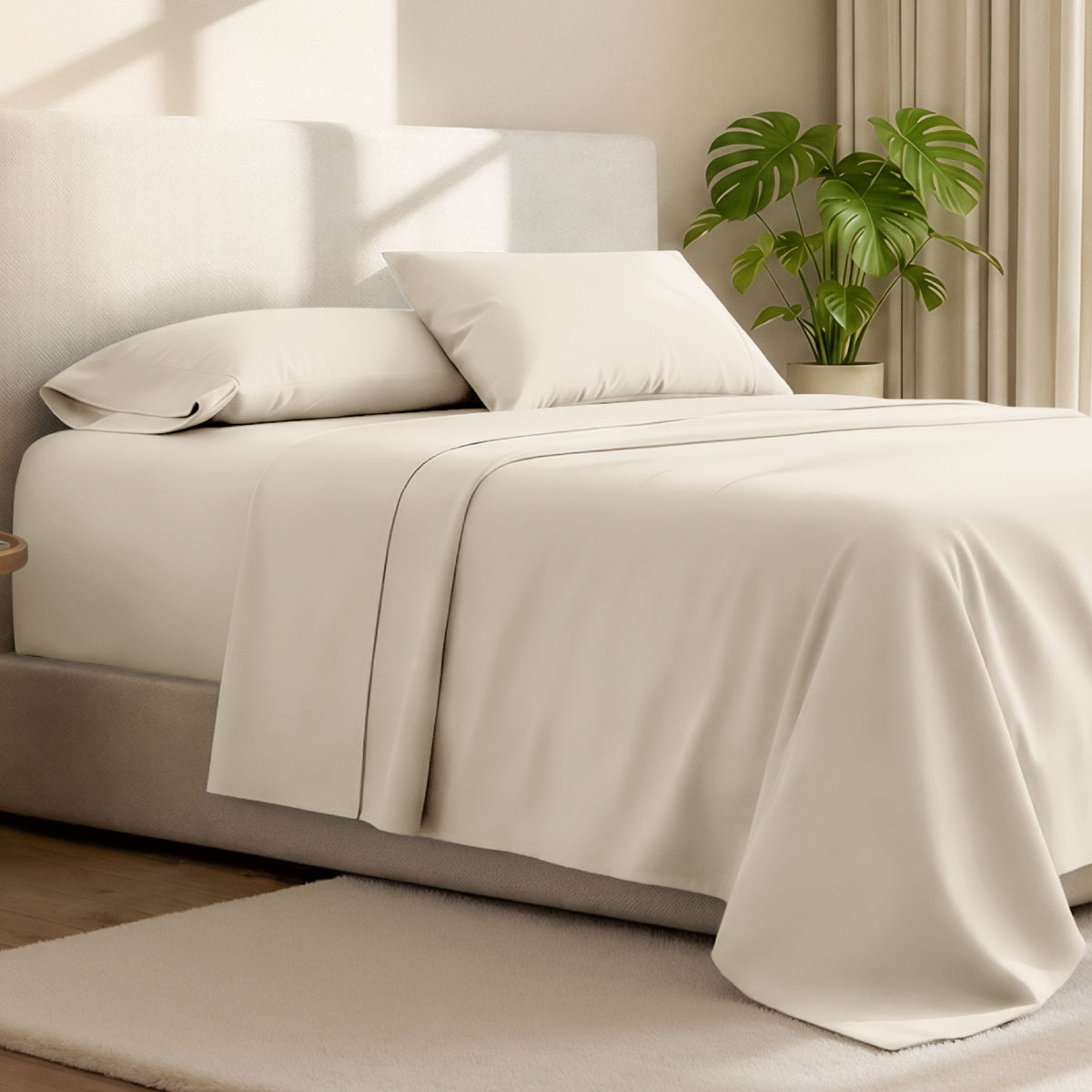 Microfiber bed sheets on a neatly made bed with a wooden headboard and nightstand.