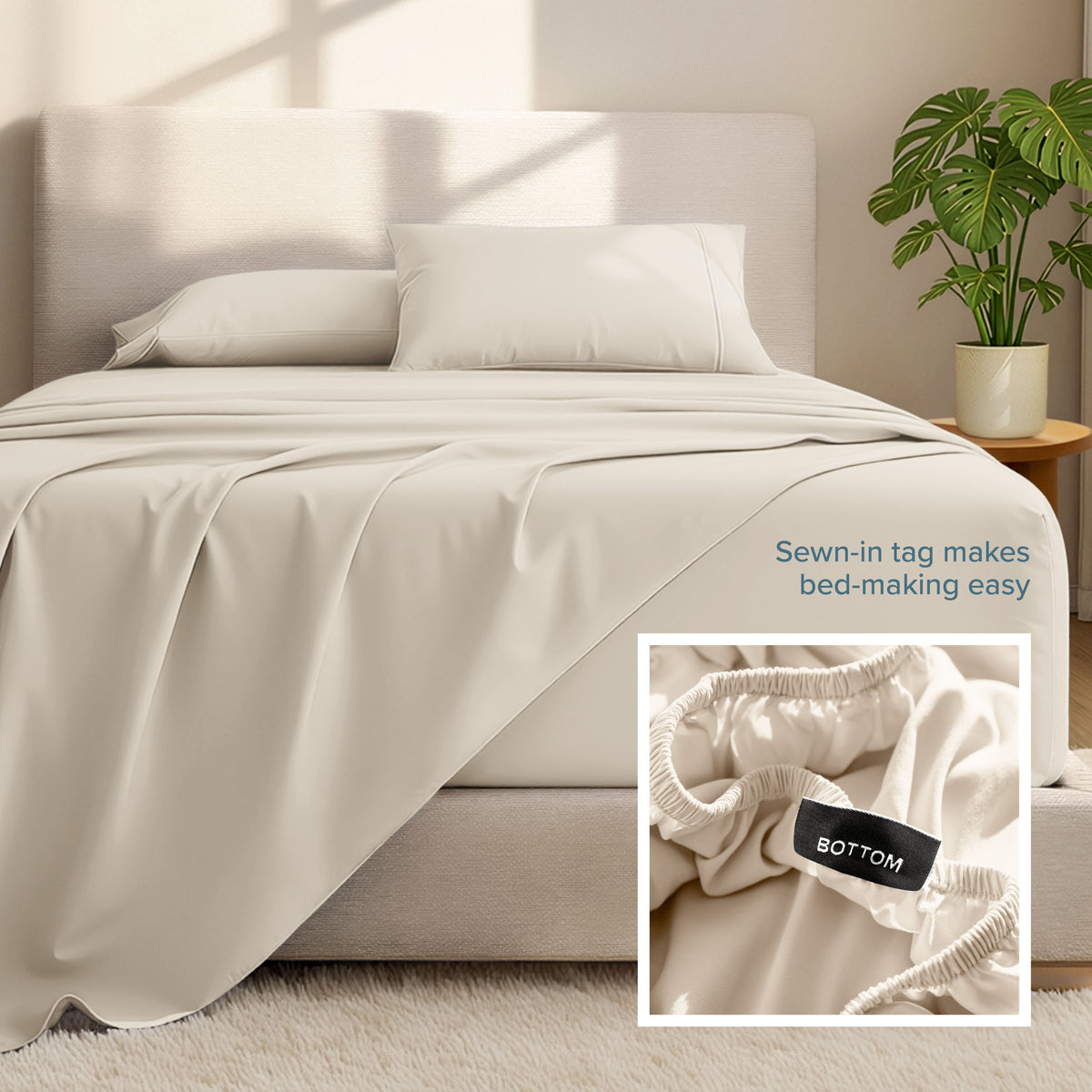 Bed sheets and pillows on a bed with a plant in the background