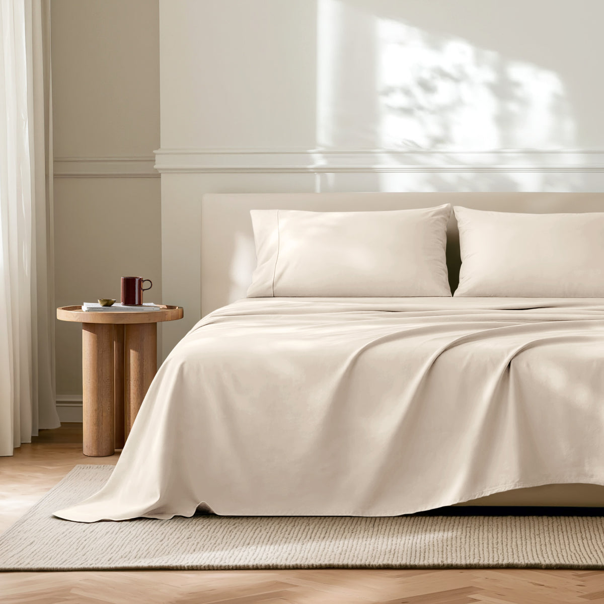 Neatly made bed with microfiber bedding in a bright bedroom.