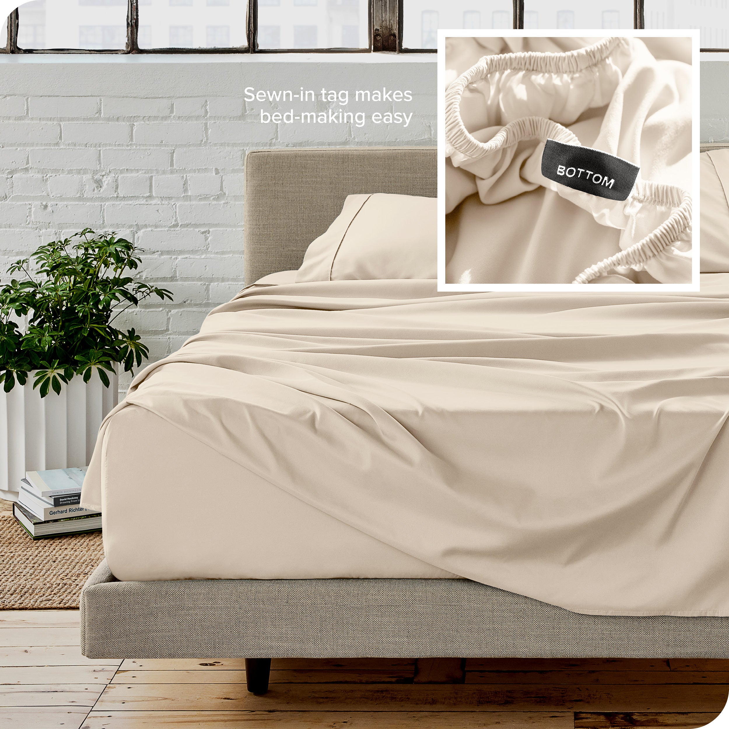 Close up of sewn in tag and matching sheets on a bed