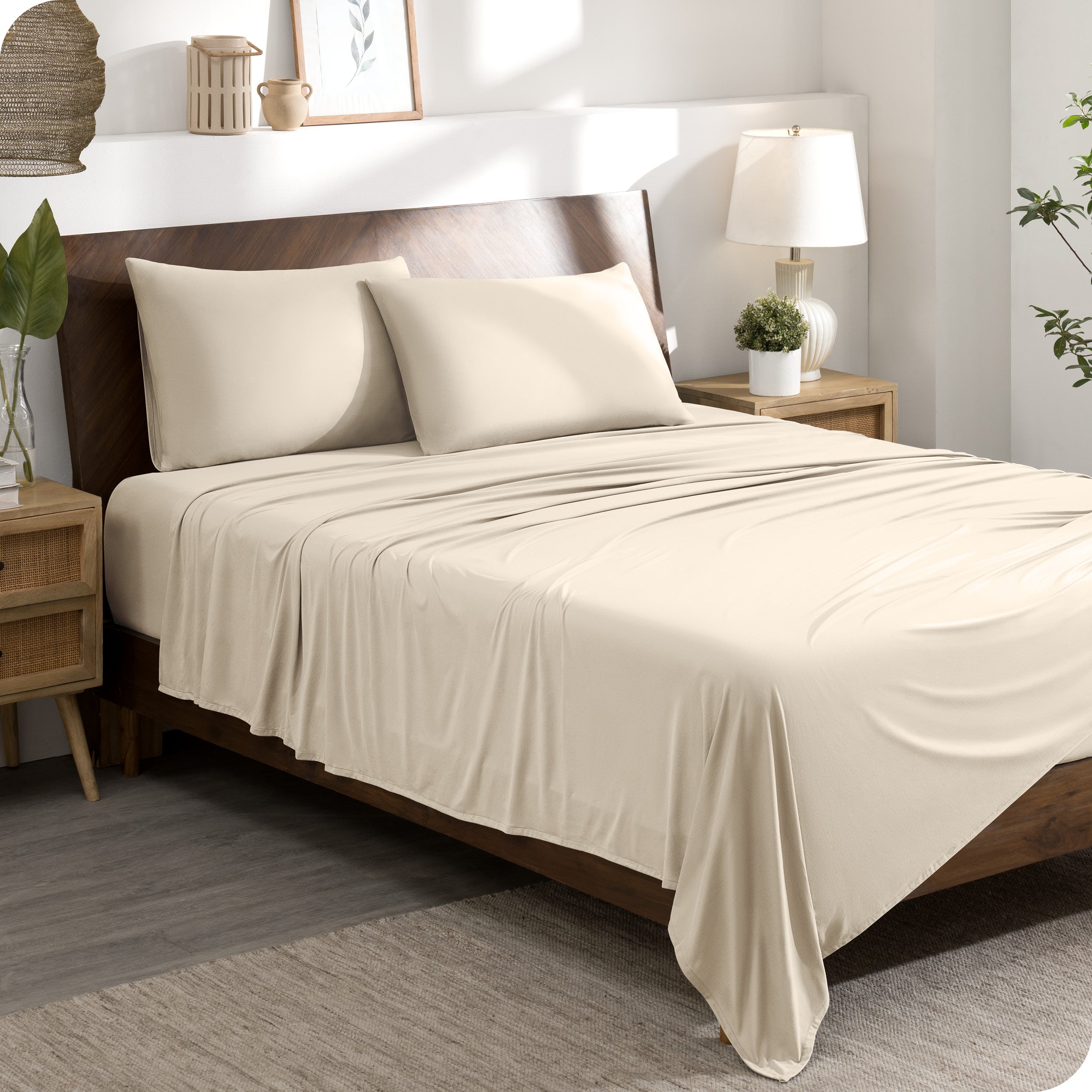 A modern bedroom set with a sand sheet set on the bed