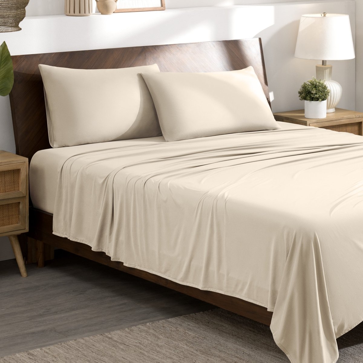 Bed sheets and pillows on a bed in a bedroom setting.