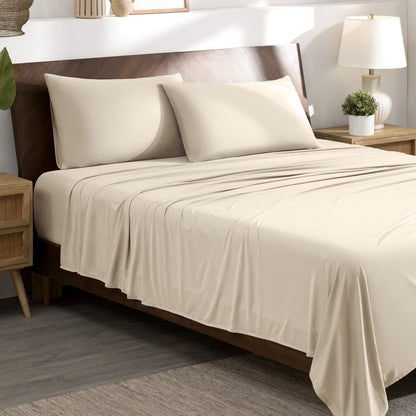 Bed sheets and pillows on a bed in a bedroom setting.