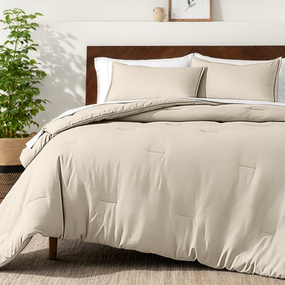 Bedding set on a bed in a bedroom with a side table and lamp.