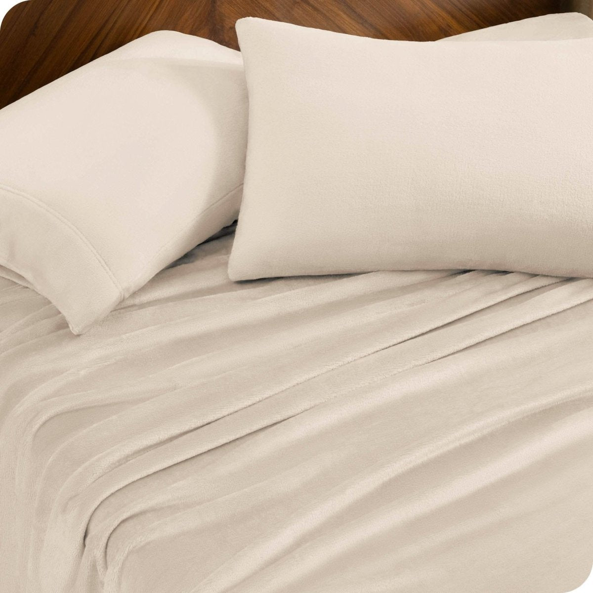 A sheet set and matching pillowcases on a bed.