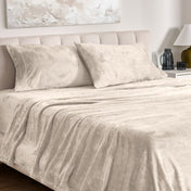 Microplush sheet set on a bed.