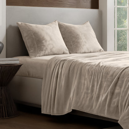 Microplush sheet set on a bed.