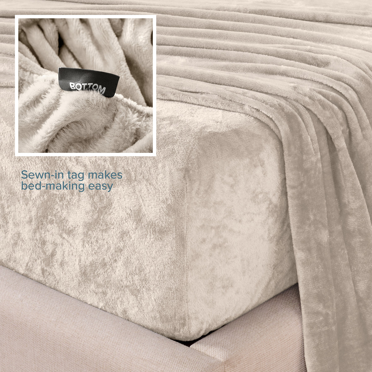 Close-up of the corner of a bed made with microplush sheets