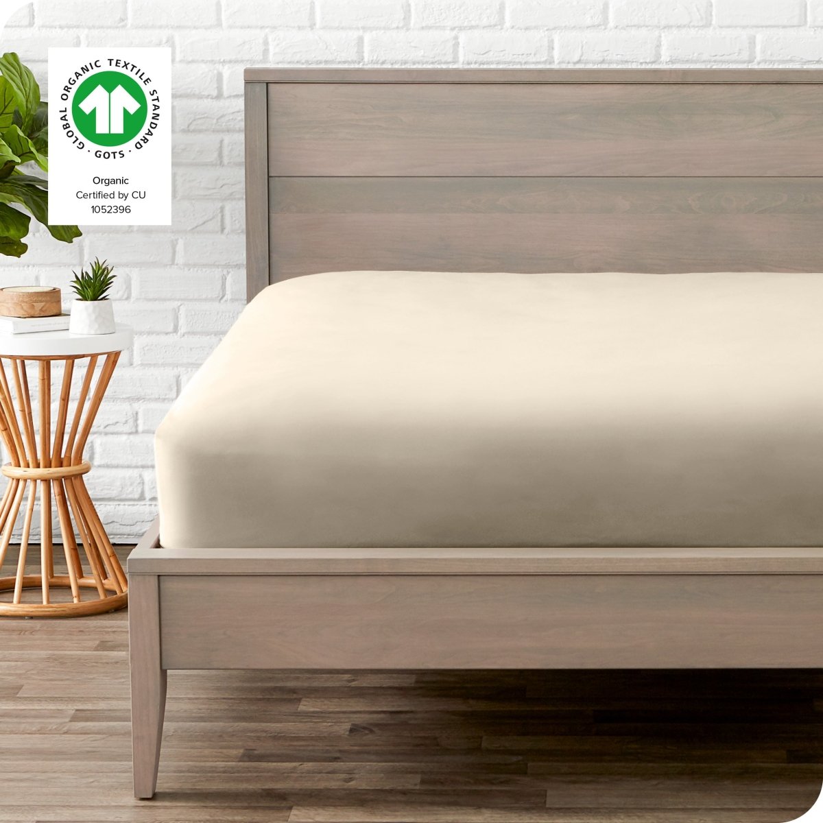 Modern wood bed frame with a sateen fitted sheet on the mattress