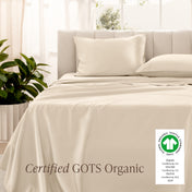 Bed with sateen bedding and pillowcases, featuring a GOTS Organic certification label.