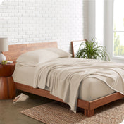 The side view of a bed made with organic cotton jersey sheets