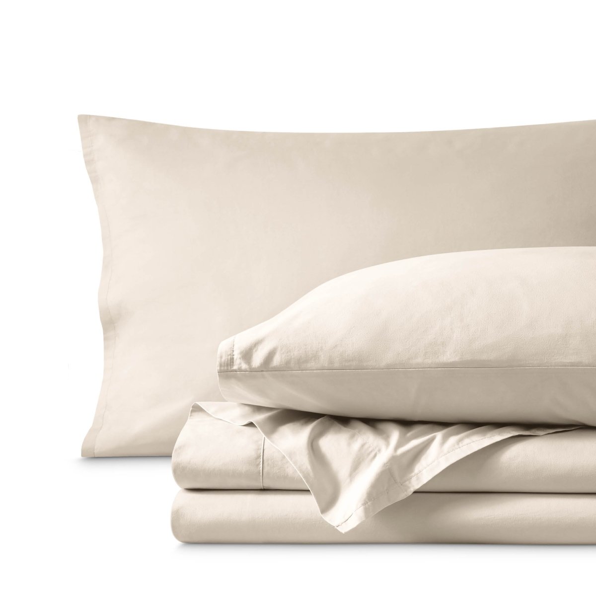 Percale bedding set including pillowcases and folded sheets arranged on a clean white background