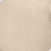 Close up of the corner of a mattress with a fleece fitted sheet on it