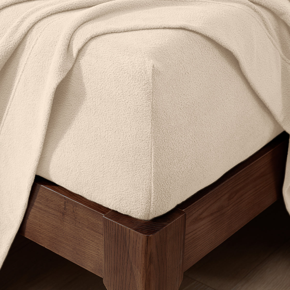 Fitted sheet on a wooden bed frame