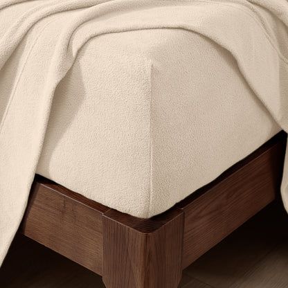 Fitted sheet on a wooden bed frame
