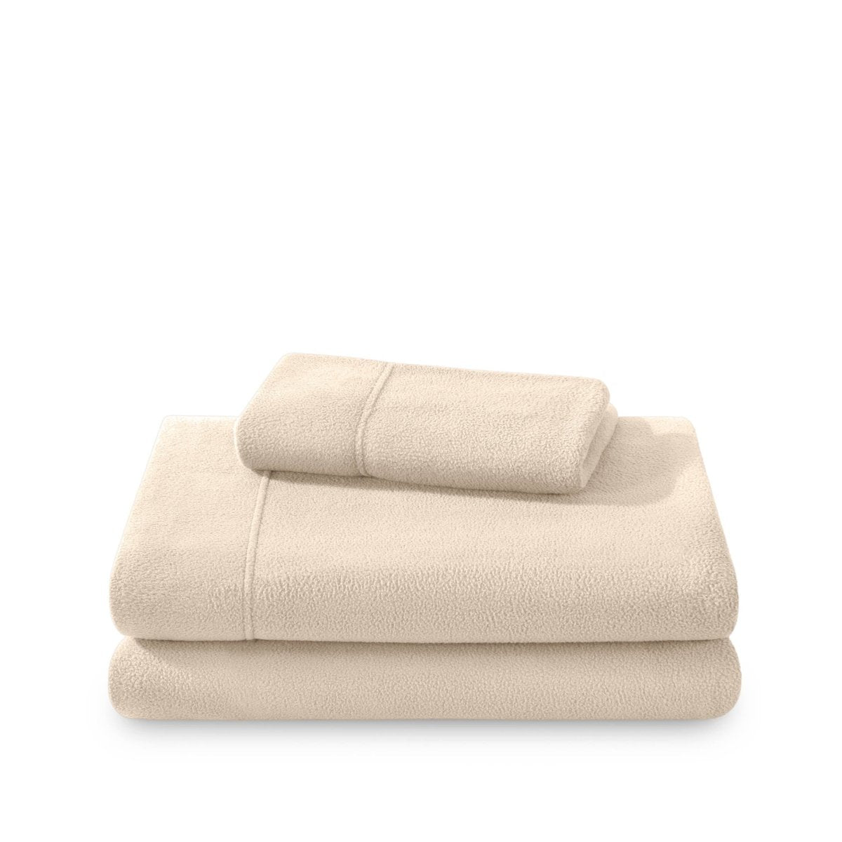 Polar fleece sheets and pillowcases folded and stacked on a white background