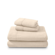 Polar fleece sheets and pillowcases folded and stacked on a white background