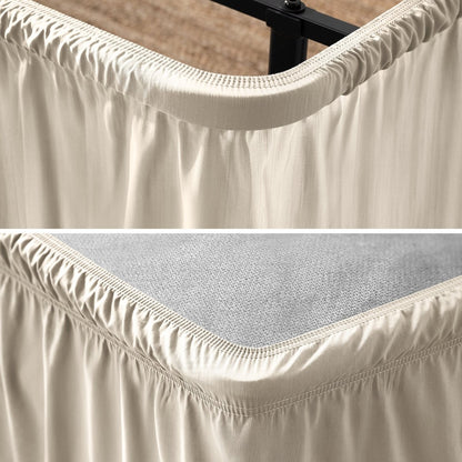 Close up of a polyester wrap around bed skirt on a bed frame and box spring