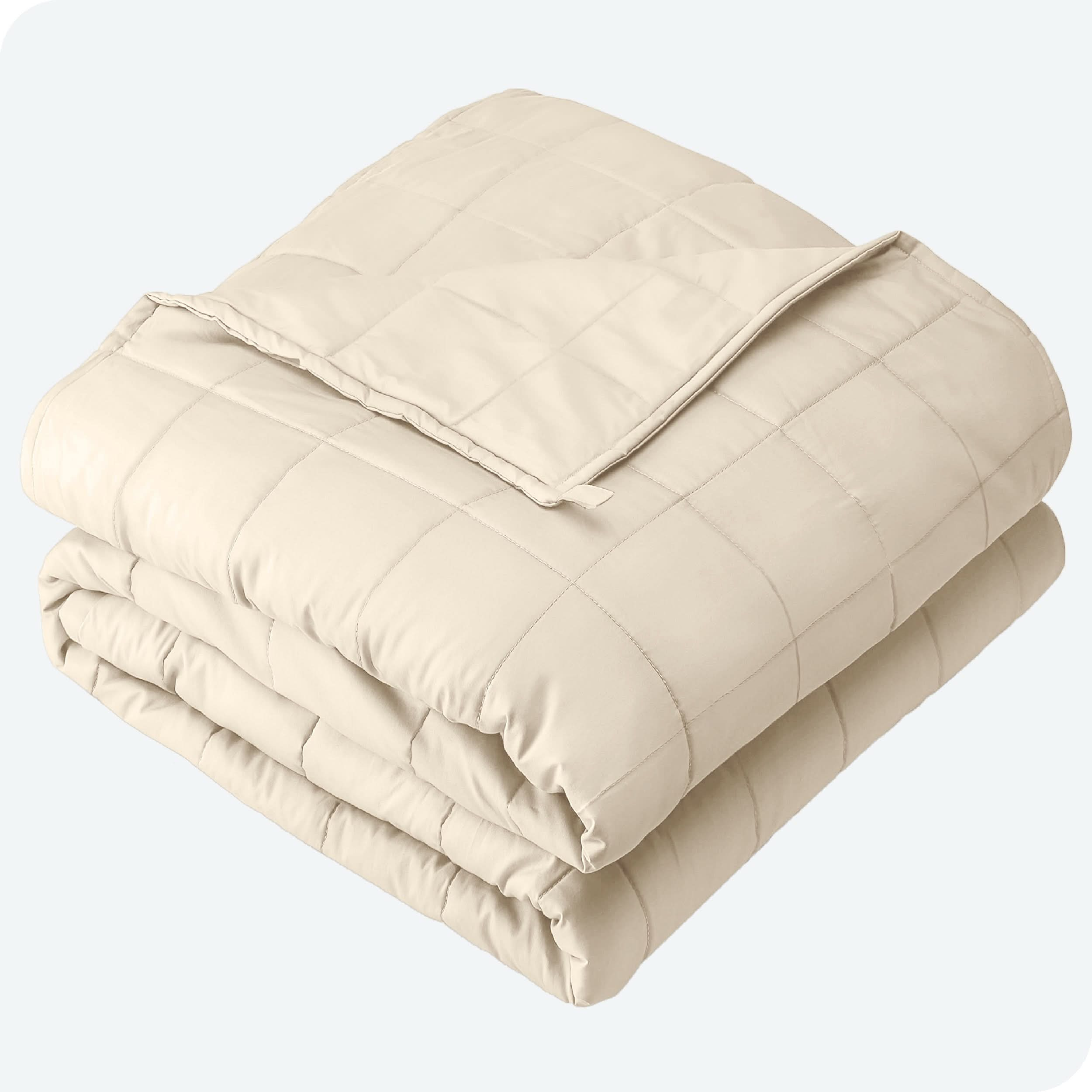 A folded cotton weighted blanket with a white background.