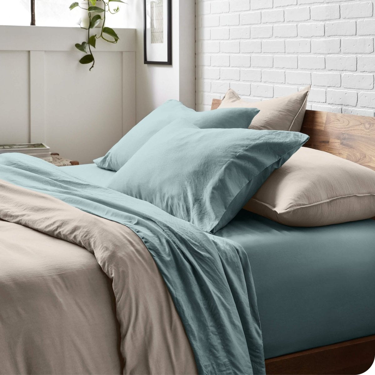 Modern bedroom with washed sheets and duvet cover on a bed