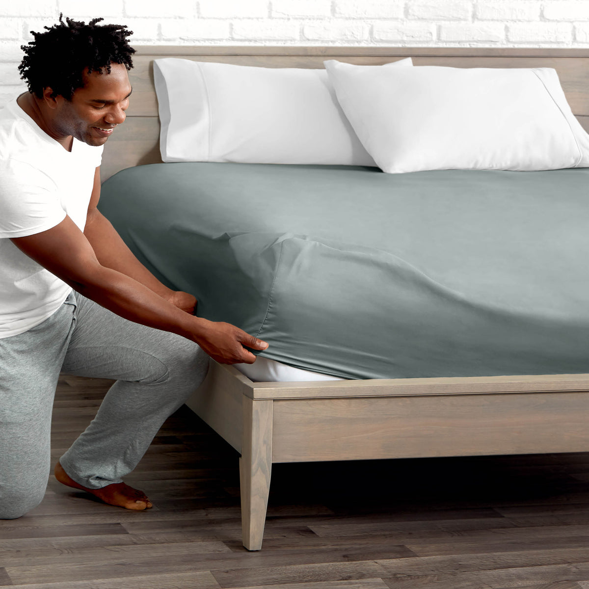 Ultra soft fitted sheet on a mattress with the sun shining into the bedroom