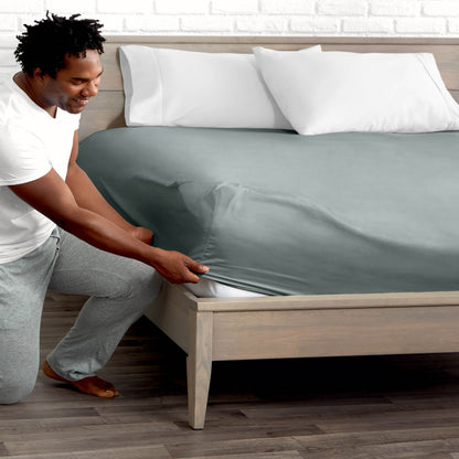 Ultra soft fitted sheet on a mattress with the sun shining into the bedroom