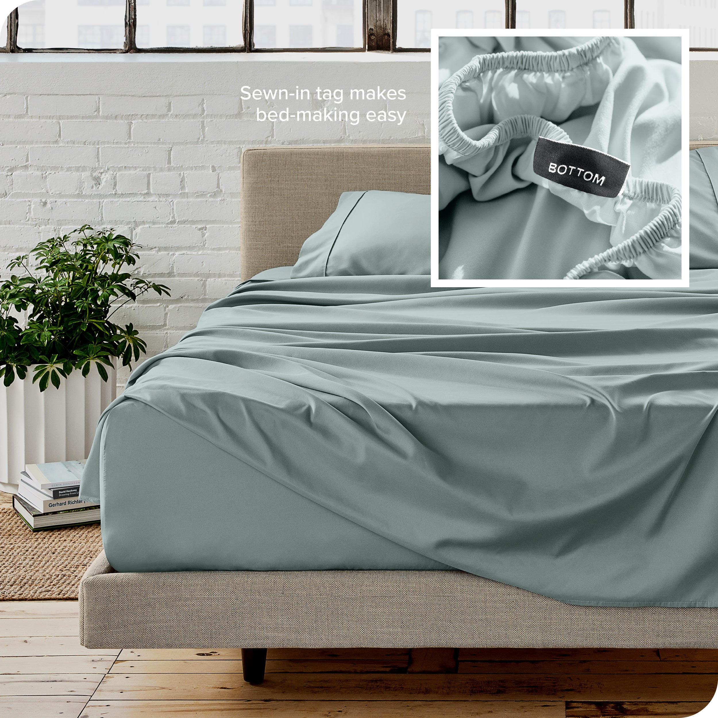 Close up of sewn in tag and matching sheets on a bed