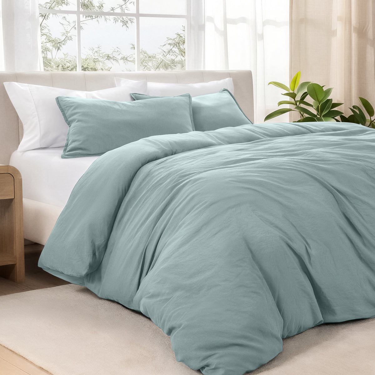 Bedding set on a bed in a bright room with natural light